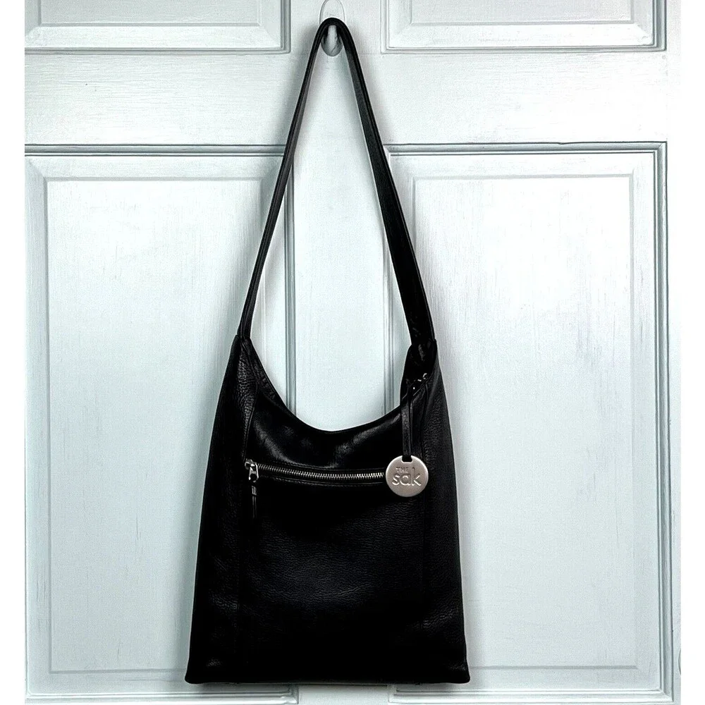 The Sak Hobo Shoulder Bag Pebbled Black Leather Pockets Signature Charm Roomy